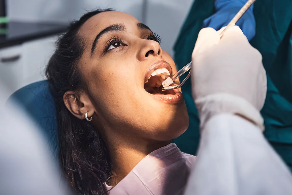 A woman getting a dental exam - Dental Procedures in Bakersfield, CA